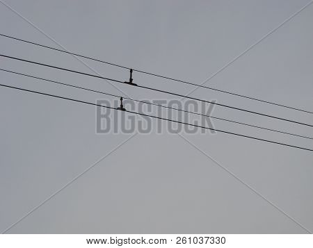 Wires Pole With Blue Sky. Electrical Wires On A Background. Electric Cables. Power Cable With Blue S