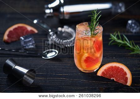 Grapefruit And Rosemary Cocktail And Bartending Tools.selective