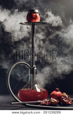 Hookah Hot Coals On Shisha Bowl With Black Background. Stylish Oriental Shisha. Garnet