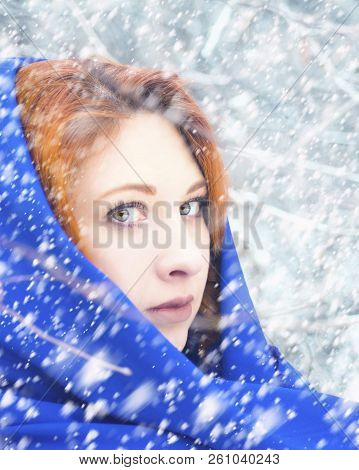 Fashion Portrait Of A Beautiful Woman With Red Hair In The Winter Woods. Vertical Crop 4x5