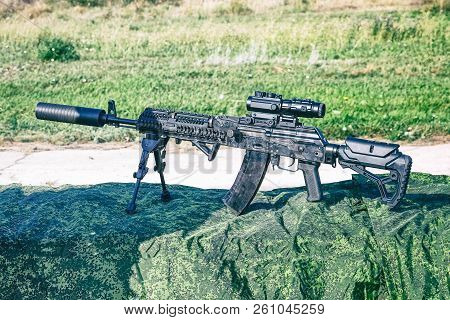 The Upgraded Kalashnikov Ak47 Assault Rifle On Bipods With Tactical Accessories, An Optical Sight An
