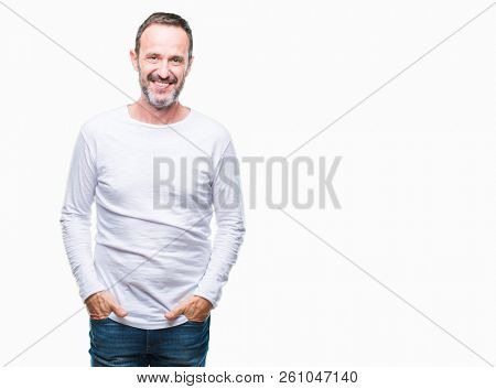 Middle age hoary senior man wearing white t-shirt over isolated background with a happy and cool smile on face. Lucky person.