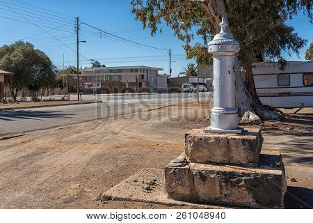 Petrusville, South Africa, August 6, 2018: A Street Scene, With The Historic Pillar Fountain Erected