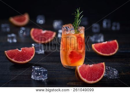 Refreshing Cocktail With Ice Grapefruit And Rosemary.selective F