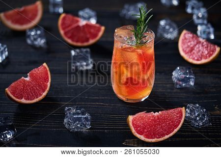 Refreshing Cocktail With Ice Grapefruit And Rosemary.top View