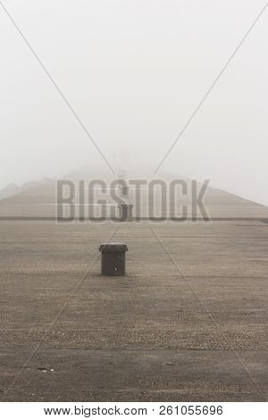 A Pier On Lake Michigan Obscured By Thick Fog.  Sheboygan, Wisconsin, Usa.