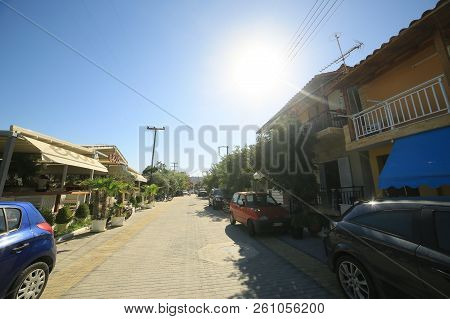 Sarti, Greece - September 23, 2014:greek City In The Summer, Cars At The Roadside