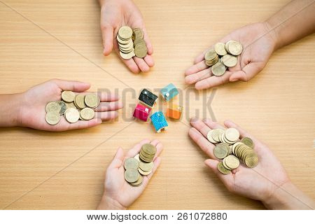 Coin Money On Humen Hand,finance And Banking, The Concept Of Saving Money And Buying A Home.