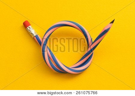 Flexible Pencil . Isolated On Yellow Background. Flexible