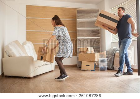 Couple Entering In Their New House With Boxex
