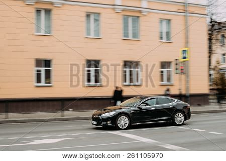 Gomel, Belarus - April 1, 2017: Black Color Tesla Model S Car In Motion On Street. The Tesla Model S
