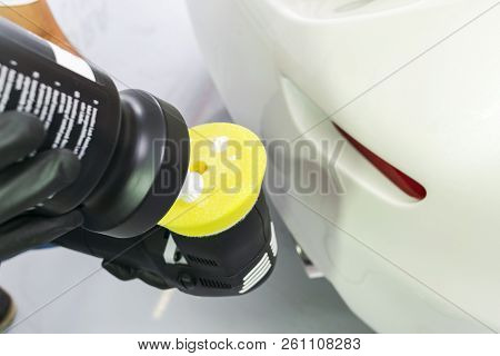 Car Polish Wax Worker Hands Holding Polisher And Polish. Close Up At Hand Holding Car Polisher. Man 