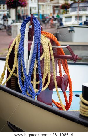 Cruising Ship In The Leiden Harbor With The Colorful Ropes