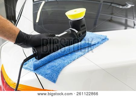 Car Polish Wax Worker Hands Holding Polisher And Polish. Close Up At Hand Holding Car Polisher. Man 