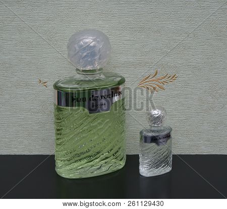 Eau De Rochas, Fragrance For Ladies, Large Perfume Bottle Next To A Commercial Perfume Bottle In Fro
