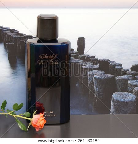 Davidoff Cool Water, Eau De Toilette, Large Perfume Bottle In Front Of The Picture Of A Groyne In Th