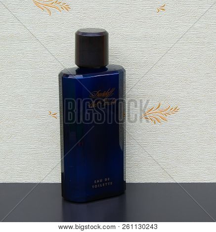 Davidoff Cool Water, Eau De Toilette, Large Perfume Bottle In Front Of The Satin Wallcovering Elysee