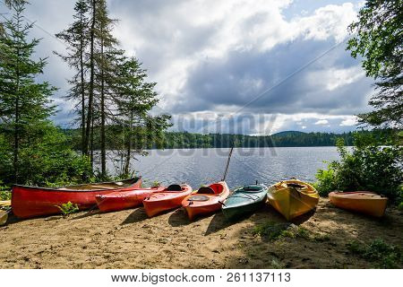 Kayaks And A Canoe By The Indian Lake In Upstate Ny (usa)