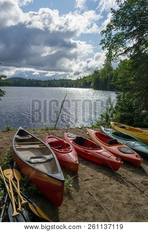 Kayaks And A Canoe By The Indian Lake In Upstate Ny (usa)