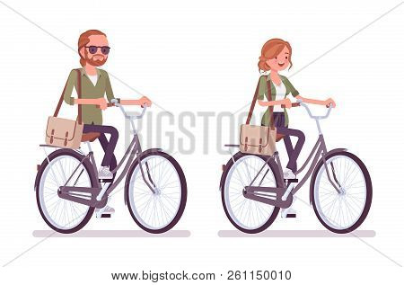 Young Red-haired Man And Woman Riding A Bicycle. Caucasian Boy And Girl With Ginger Hair, Wearing Ur