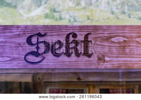 Wooden Signs From At The German Oktoberfest Referring To Champagne-sekt Area Where People Can Buy Al