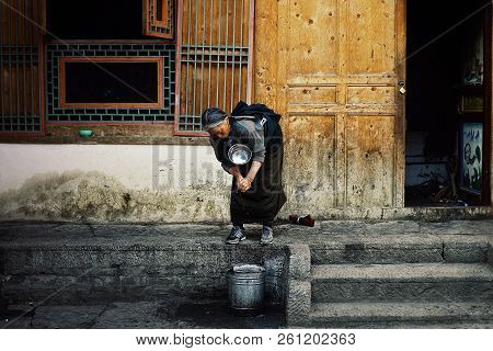 Labrang Monastery, Xiahe, Gansu Province / China - Jun 6 2011: Elderly Tibetan Buddhist Pilgrim Woma