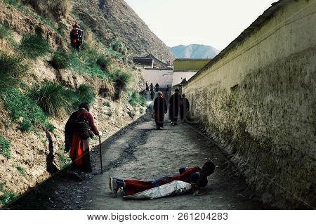Labrang Monastery, Xiahe, Gansu Province / China - Jun 6 2011: People Walking Around The Tibetan Bud