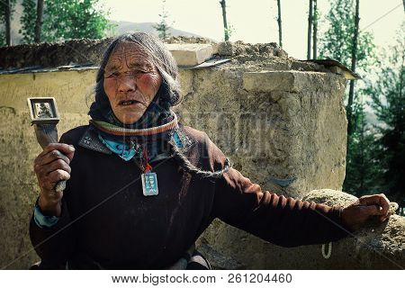 Labrang Monastery, Xiahe, Gansu Province / China - Jun 6 2011: Old Tibetan Buddhist Pilgrim Lady Wal