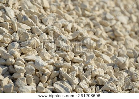 Breakstone background. Road gravel. Gravel texture. Crushed Gravel background. Piles of limestone ro