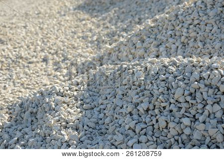 Breakstone background. Road gravel. Gravel texture. Crushed Gravel background. Piles of limestone ro