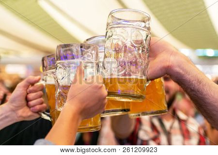Koblenz Germany 26.09.2013 A Group Of Young People Friends Toasting With Glasses Of Bitburger Beer
