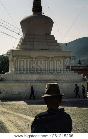 Labrang Monastery, Xiahe, Gansu Province / China - Jun 6 2011: Tibetan Buddhist Pilgrims Walking Aro