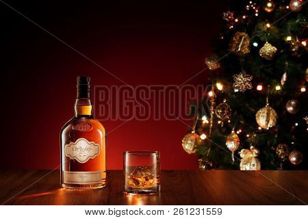 No Logo Or Trademark! Self Made Labels!  View Of Glass With Ice And Whiskey And A Bottle Aside.