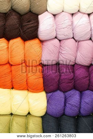 Many Balls Of Wool Of Different Colors Stacked Neatly