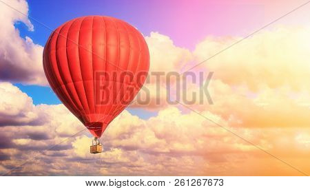Red Balloon Against A Blue Cloudy Sky. Sun Rays And Glare. Dreamy Clouds. Aerostat. People In The Ba