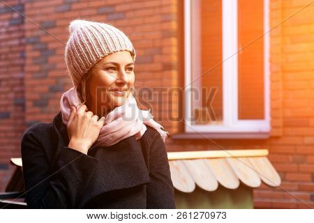 Portrait Female Student On Bright Background. Beautiful Modern Urban Young Woman Wearing Pink Knitti