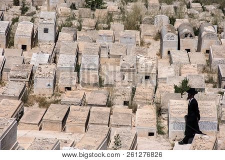 Orthodox Jew Visiting The Cemetery In Jerusalem