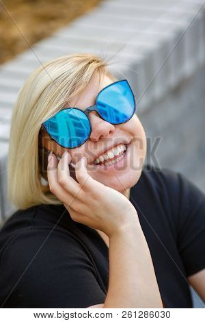 Portrait Young Girl Freelancer, Student In Sunglasses Plus Size Outdoors, Talking On The Phone, Laug