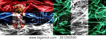 Serbia Vs Nigeria, Nigerian Smoke Flags Placed Side By Side. Thick Colored Silky Smoke Flags Of Serb