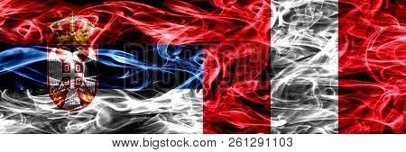 Serbia Vs Peru, Peruan Smoke Flags Placed Side By Side. Thick Colored Silky Smoke Flags Of Serbian A