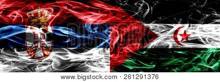 Serbia Vs Sahrawi Smoke Flags Placed Side By Side. Thick Colored Silky Smoke Flags Of Serbian And Sa