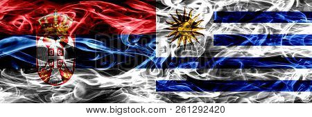 Serbia Vs Uruguay, Uruguayan Smoke Flags Placed Side By Side. Thick Colored Silky Smoke Flags Of Ser