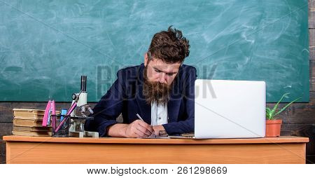 School Teacher Checking Homework Or Test. School Paperwork. Paperwork Part Of Teachers Life. Teacher