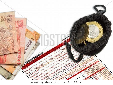 Tax Form Itr-1 With Indian Currency Left Space To Write, An Contains Coins Nd Note.