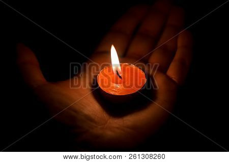 Burning Candle On The Palm, Close Up