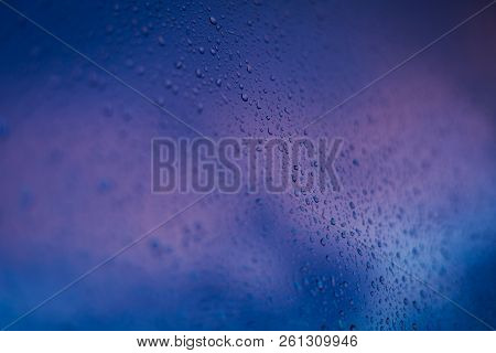 Drops Of The Rain On The Window Glass. Wet Background