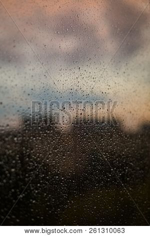 Drops Of The Rain On The Window Glass. Wet Background