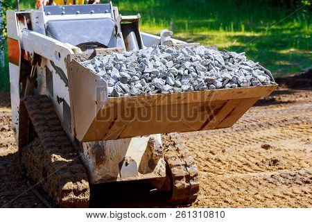 Wheel Excavator With Hydraulic Which Is Folded Into Transport Position Loader Dumping Gravel