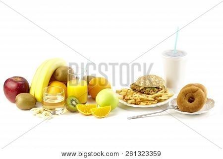 Assorted Fresh Fruits, Juice, Hamberger, French Fries, Doughnuts And Soft Drink Isolated On White Ba