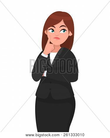 Beautiful Attractive Businesswoman Thinking While Touching Her Finger On Face With Thoughtful Expres